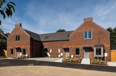 Front view of brown brick housing development at Armoury Drive