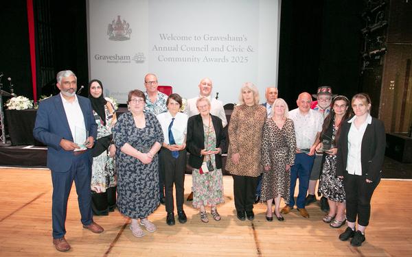 Group of people standing with their awards they won from the Gravesham civic and Community Award winners 2025