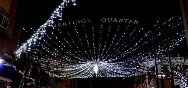 Centre piece light display looking from below, illuminated at night time.