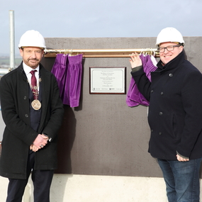 Mayor of Gravesham Peter Scollard and Councillor Lenny Rolles standing in front of a plaque