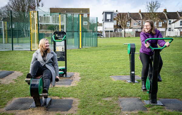 Cllr sullivan cllr morely using new park equipment 2