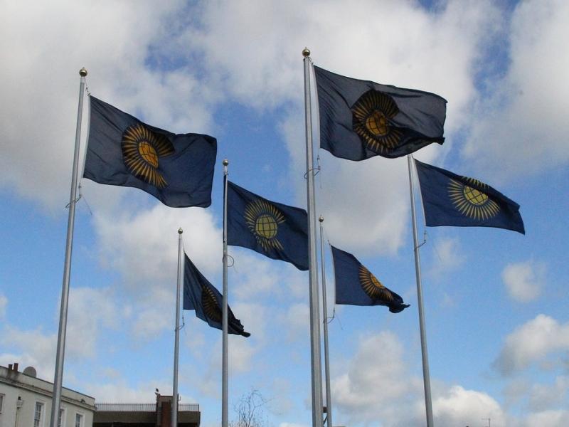 6 commonwealth flags flying full mast on community square Gravesend.