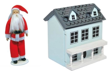 Father Christmas doll next to a dolls house