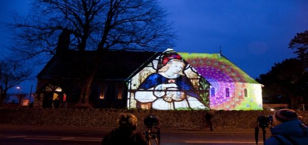 Light image being projected onto a church