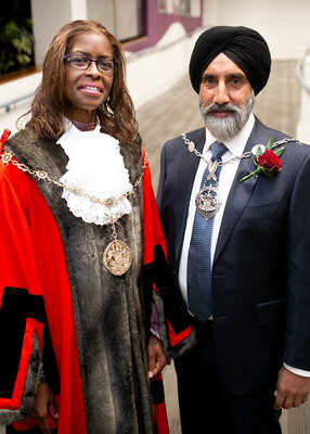 Mayor of Gravesham Cllr Alison Williams in red cloak and mayoral chains standing next to deputy mayor Cllr Baljit Hayre.