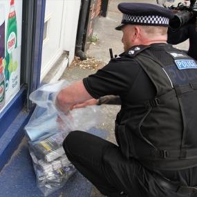 Officer searching for illegal tobacco