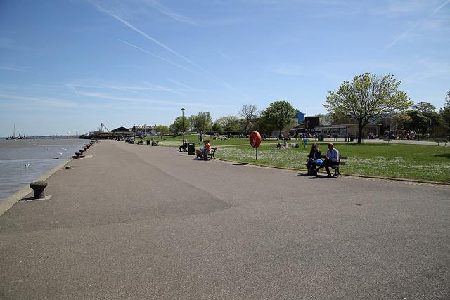 Looking along the river path from the Riverside Leisure promenade area on a sunny day.