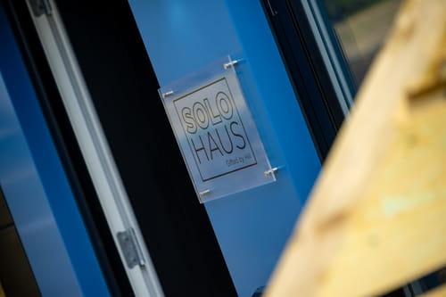 Sign reads Solo haus gifted by hill