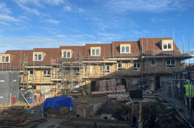 Construction of new housing development showing the scaffolding and side elevation