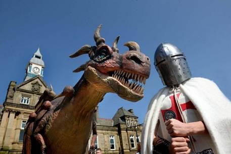 Picture of a dragon next to a knight, depicting the Saint of George who slayed the dragon.