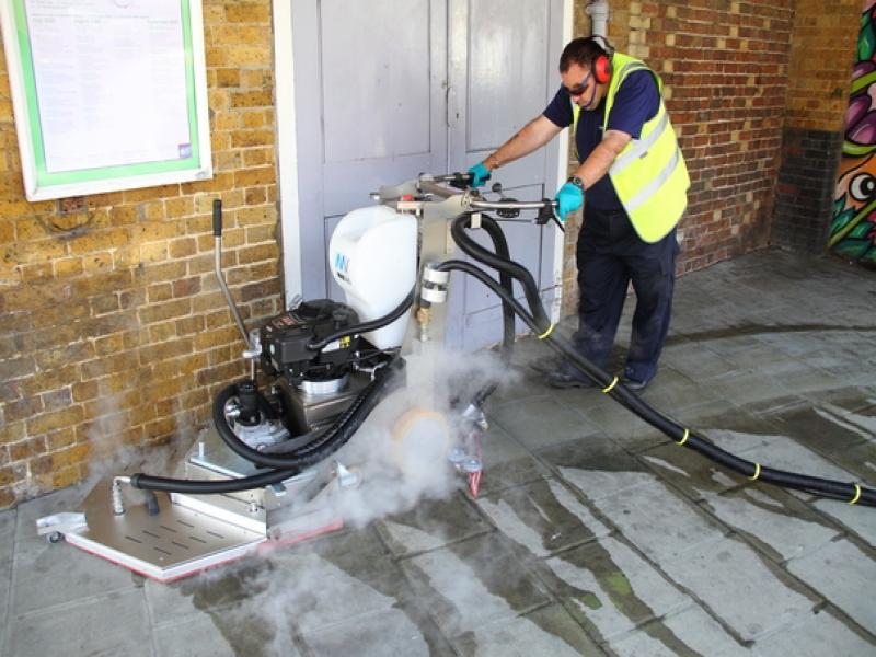 Removal of chewing gum on street using specialist steam machine