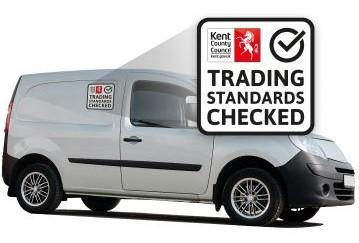 Small white van with logo on the side - close up of the logo reads trading standards checked with a tick and the Kent County Council logo