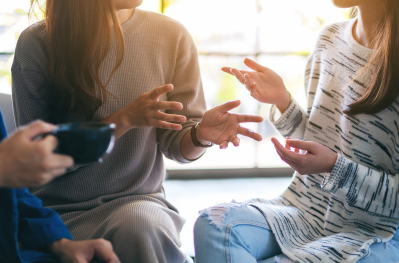 Close up of people showing their hands to show conversation community