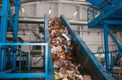 Waste plant showing cardboard on its way to be separated and recycled.